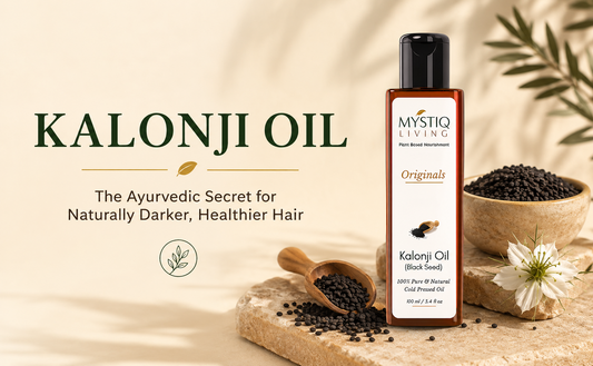 Mystiq Living 100% Pure Cold Pressed Kalonji Oil (Black Seed Oil) displayed with black seeds in a premium botanical blog cover about naturally darker, healthier hair.