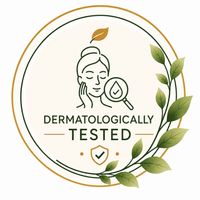 A circular graphic badge with the text 'DERMATOLOGICALLY TESTED' in dark green, featuring a line drawing of a woman's face with a magnifying droplet over her cheek, a gold leaf, green leaves on the right, and a small shield icon at the bottom, all on a light cream background.